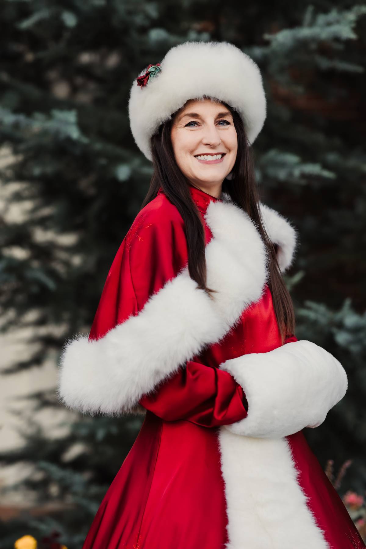 Mrs. Claus in a red velvet Christmas dress